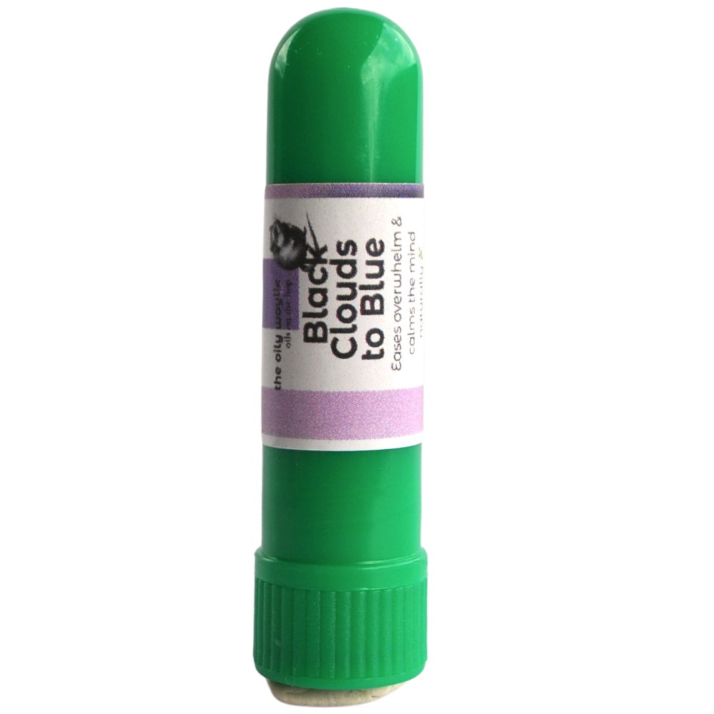 Green nasal inhaler stick with a label on a white background Black clouds to blue