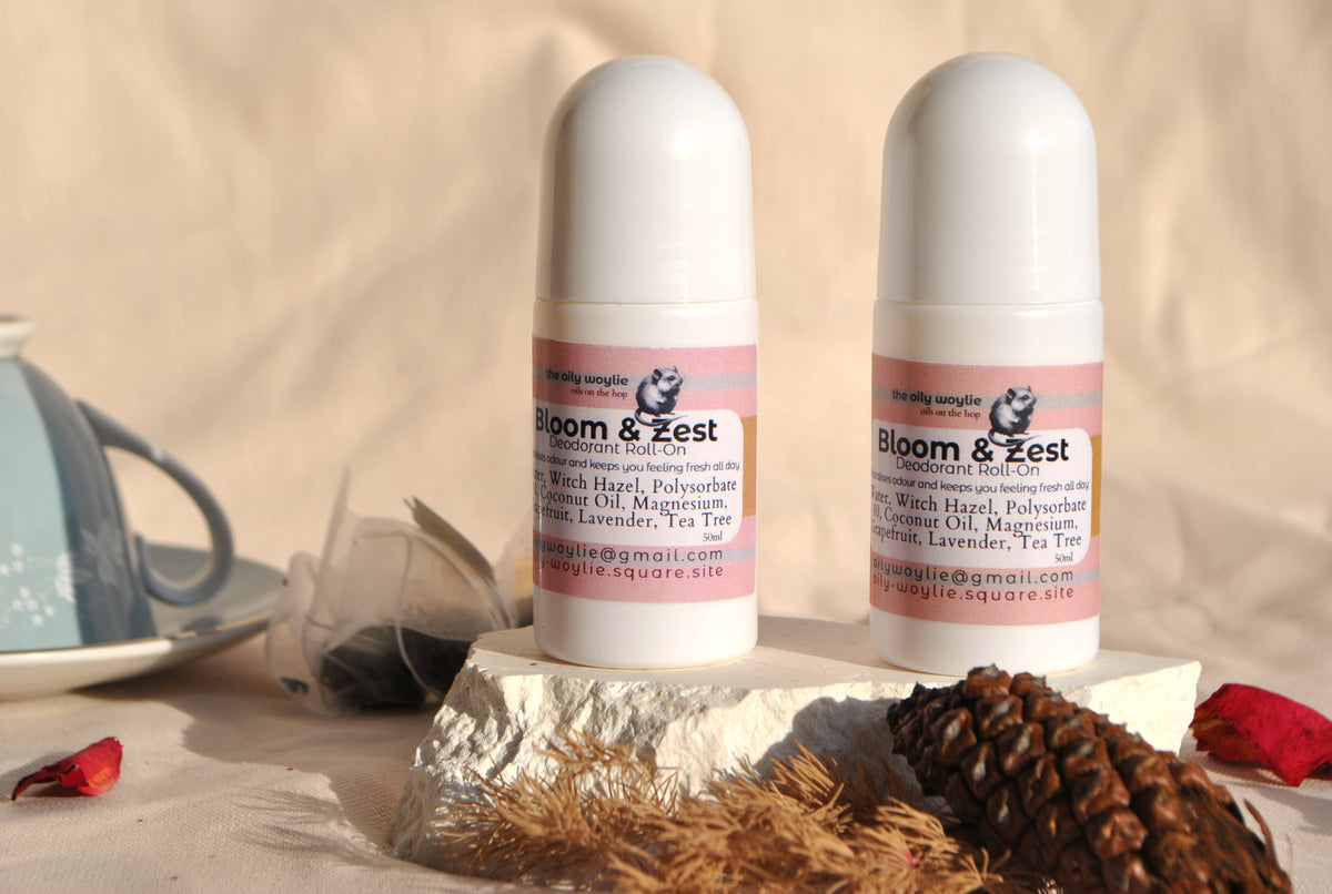 Deodorant Roll-On Bloom & Zest bottle, natural deodorant with citrus scent on a rustic surface with natural elements.