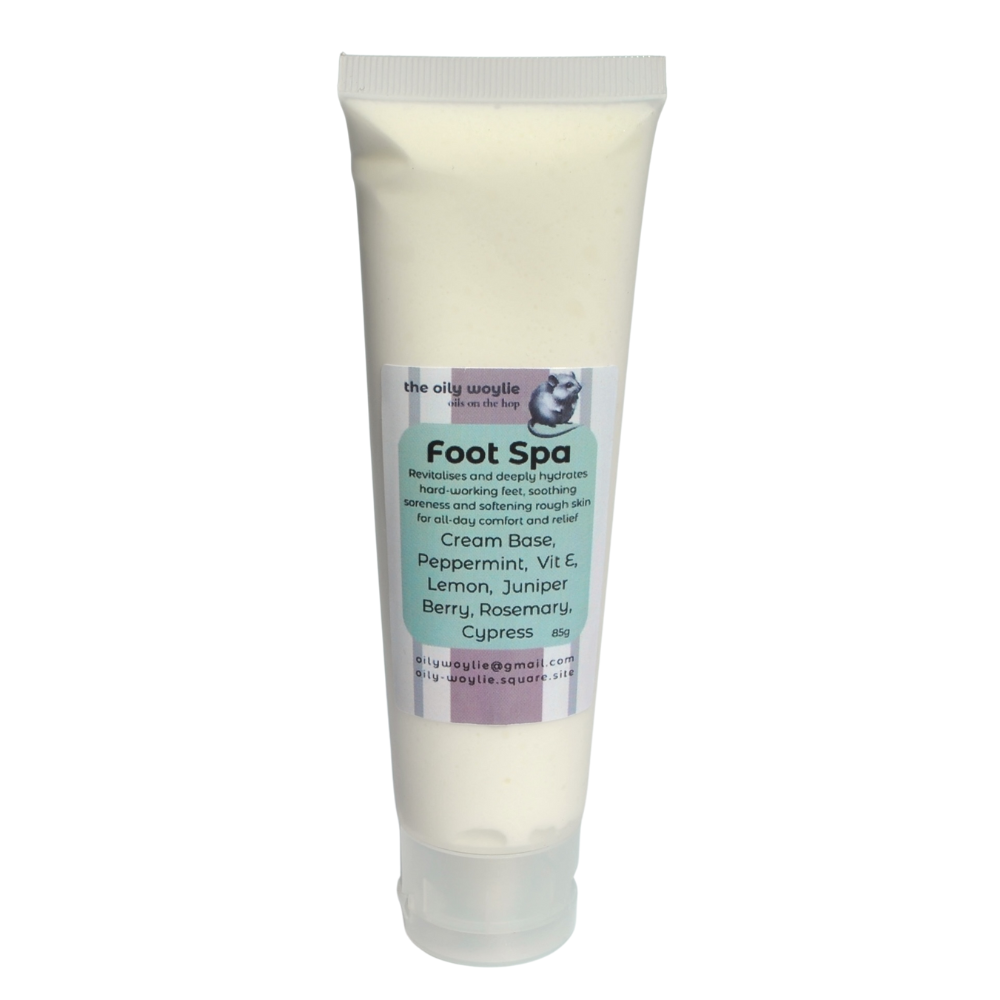 Tube of 'Foot Spa' cream with a label on a white background. Foot relaxation cream for tired, hardworking feet, massaged into heels and arches. Tube of soothing foot spa cream designed to relax sore feet and soften skin.