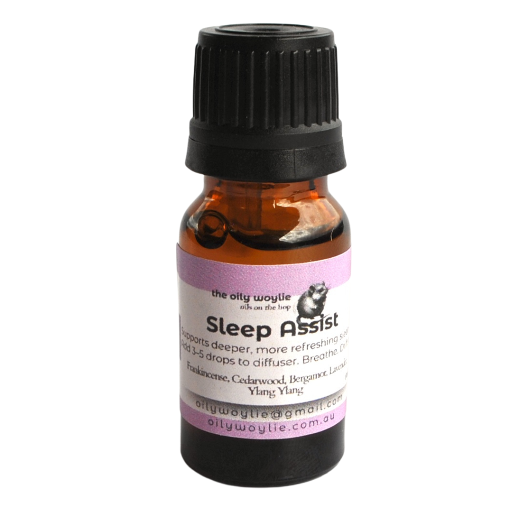 Bottle of 'Sleep Assist' essential oil with a black cap on a white background