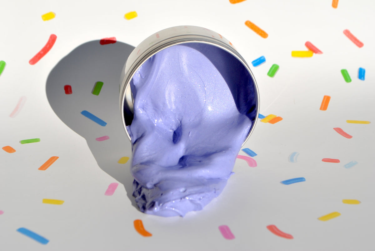 Soothe & Squish silly putty in soothing cozy scent, relaxation and sensory stress relief on confetti background