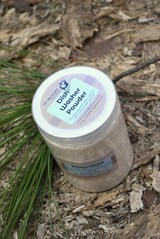 Jar of dish washer powder on a natural background with greenery