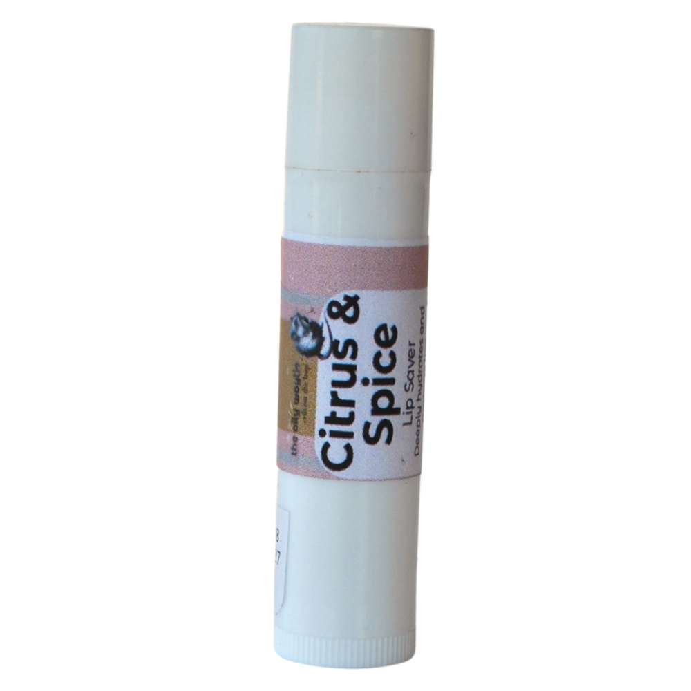Citrus and spice lip balm providing hydration and gentle aroma.