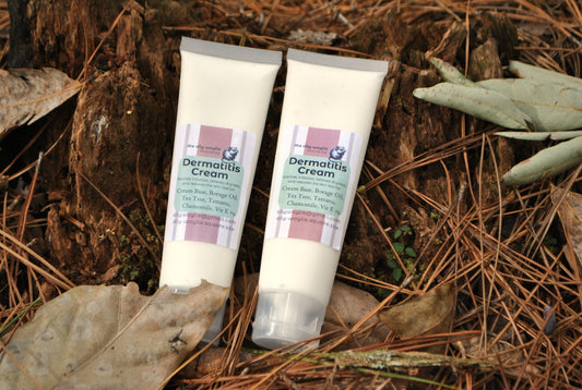 Dermatitis Cream tube, natural cream to soothe irritated and sensitive skin on a natural background with leaves and twigs.