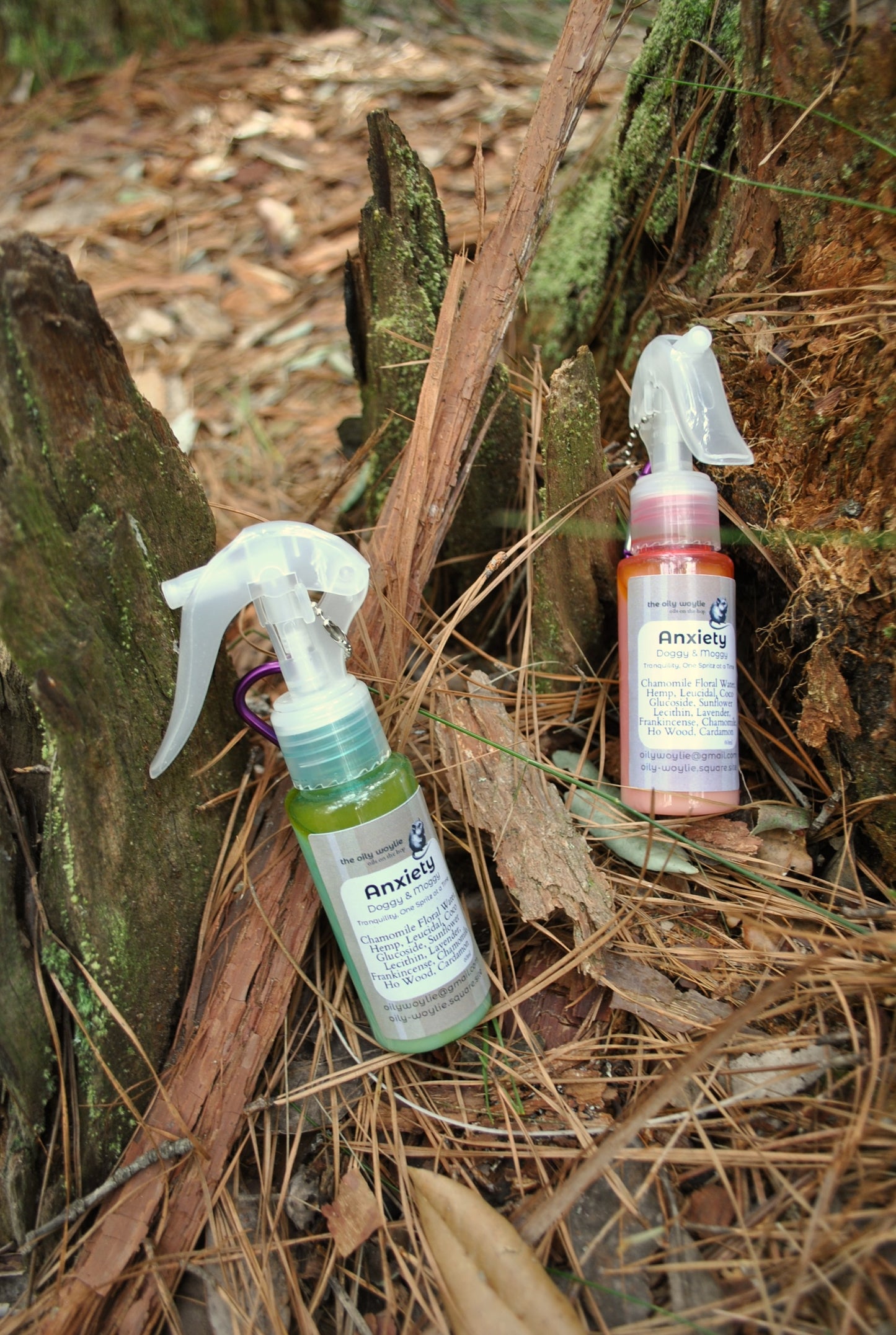 Doggy & Moggy Anxiety Blend spray bottle, natural calming spray for pets on a forest floor with leaves and branches.