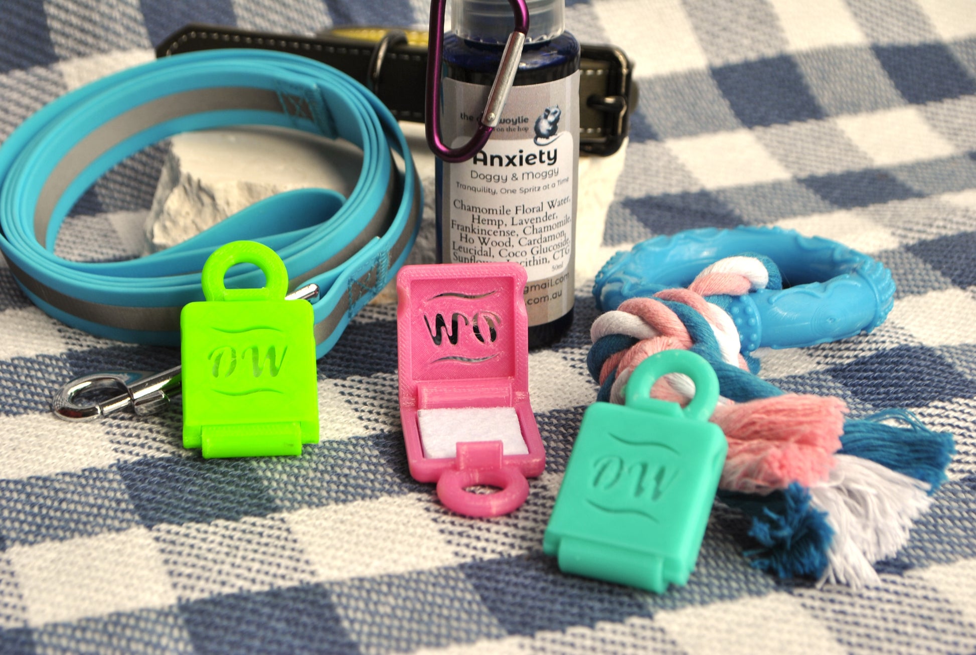Doggy & Moggy Lockets with Anxiety Spray, natural calming support for pets on a checkered background