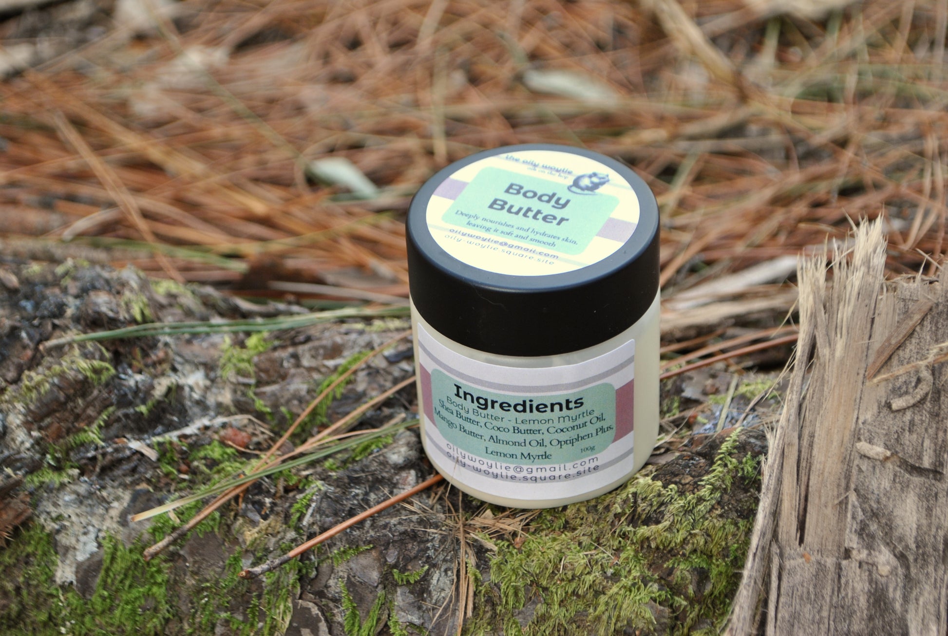 Lemon Myrtle Body Butter jar, natural moisturising body cream with lemon myrtle scent on a mossy log