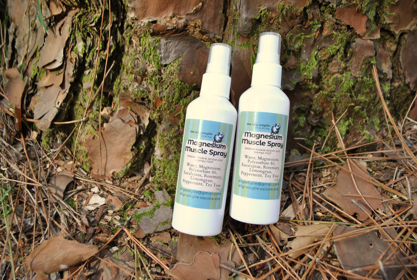 Magnesium Muscle Spray bottle, natural magnesium spray to relieve sore muscles and cramps on a natural background with leaves and moss.