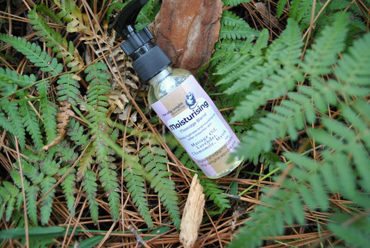 Moisturising Massage oil blend bottle, natural hydrating massage oil on fern leaves