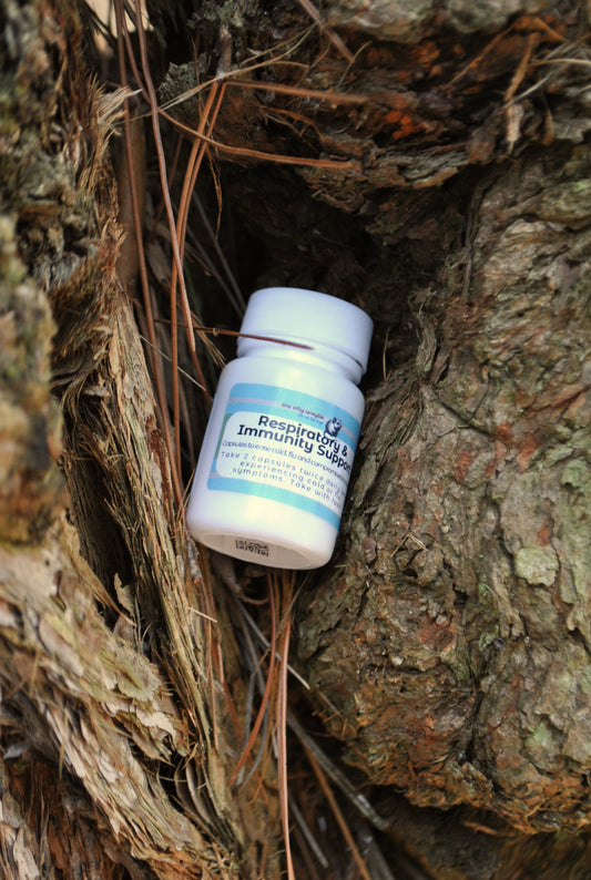 Respiratory & Immune Support Capsules bottle, natural supplement to support breathing and immunity in a tree cavity