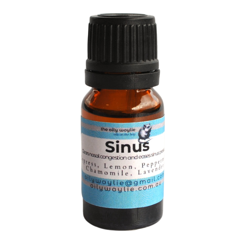 Bottle of essential oil diffuser blend designed to open and clear the sinuses. On a white background