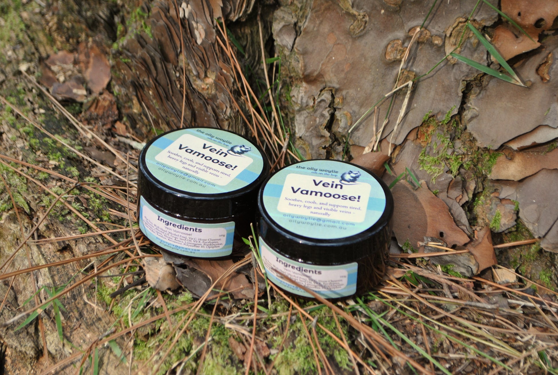Vein Vamoose natural gel jar, cooling cream to support healthy circulation on a natural background with moss and leaves.